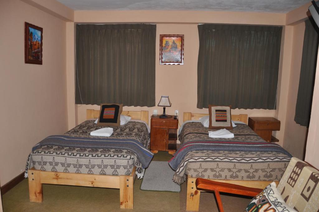 Postel nebo postele na pokoji v ubytování Hostal Goya Andina