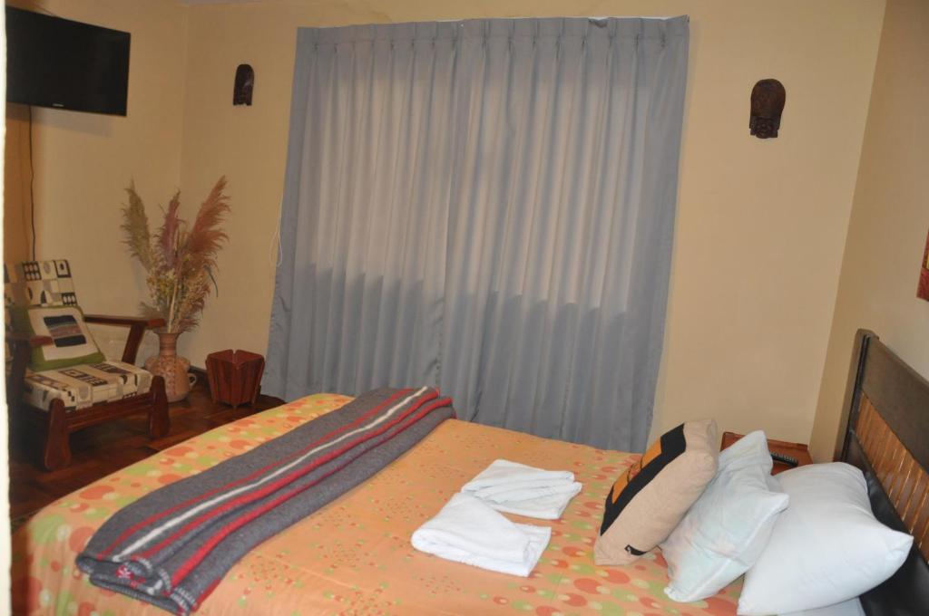 Postel nebo postele na pokoji v ubytování Hostal Goya Andina