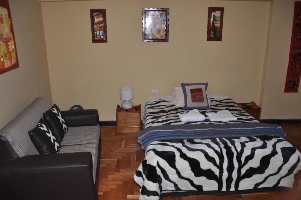 Postel nebo postele na pokoji v ubytování Hostal Goya Andina