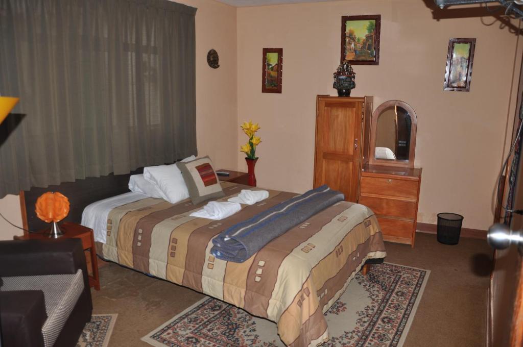 Postel nebo postele na pokoji v ubytování Hostal Goya Andina