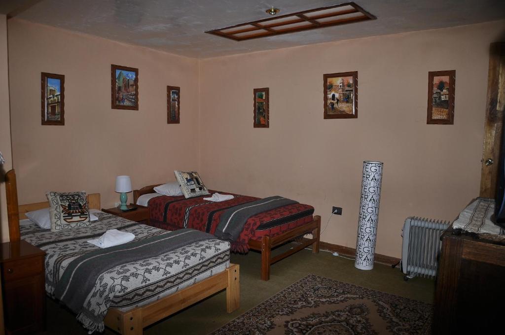 Postel nebo postele na pokoji v ubytování Hostal Goya Andina