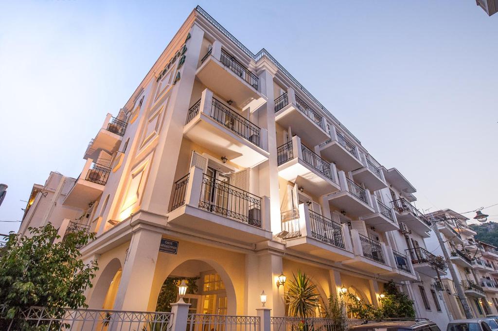 a large white building with balconies on it at Alba Hotel in Zakynthos