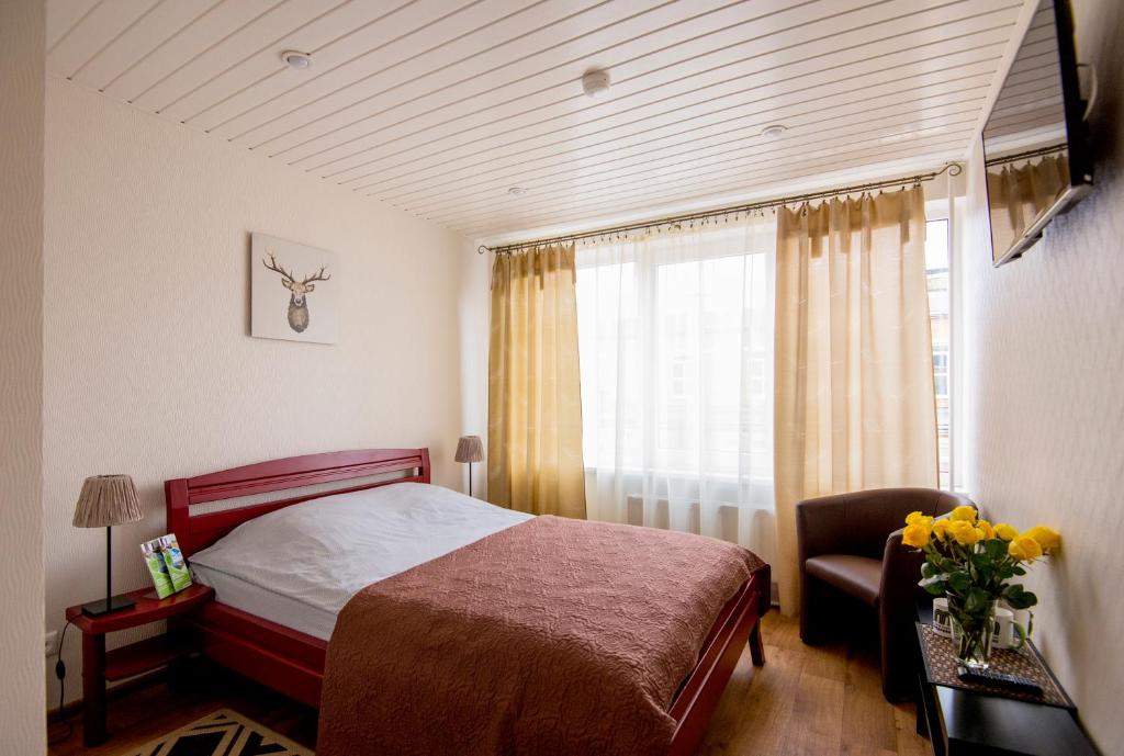 Postel nebo postele na pokoji v ubytování Hotel Mezaparks