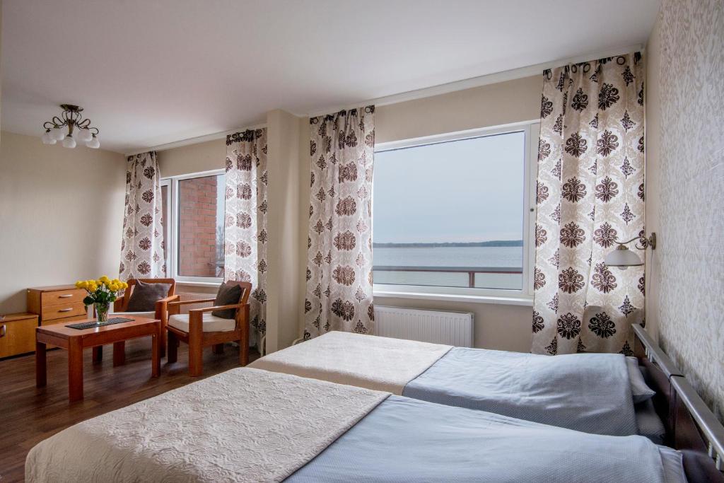 Postel nebo postele na pokoji v ubytování Hotel Mezaparks