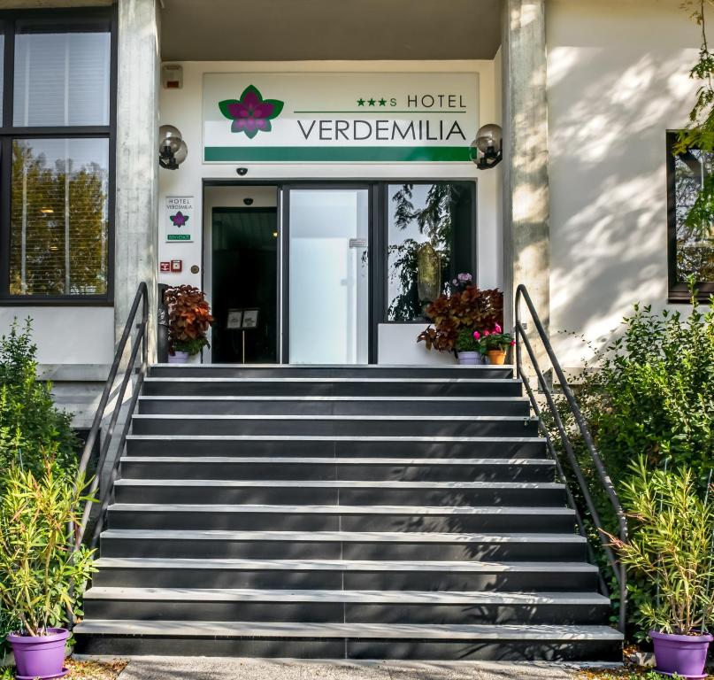 a stairway leading to a hotel with a sign on it at Verdemilia Hotel in Anzola dell'Emilia