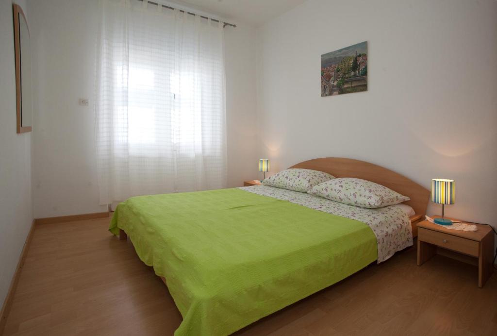 Posteľ alebo postele v izbe v ubytovaní Apartments Toplak