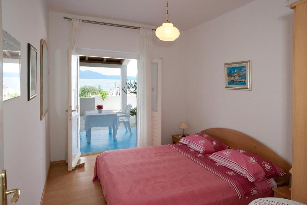 Posteľ alebo postele v izbe v ubytovaní Apartments Toplak