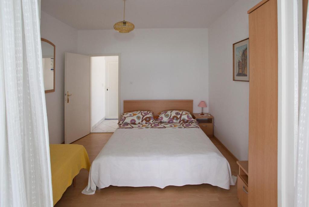 Posteľ alebo postele v izbe v ubytovaní Apartments Toplak