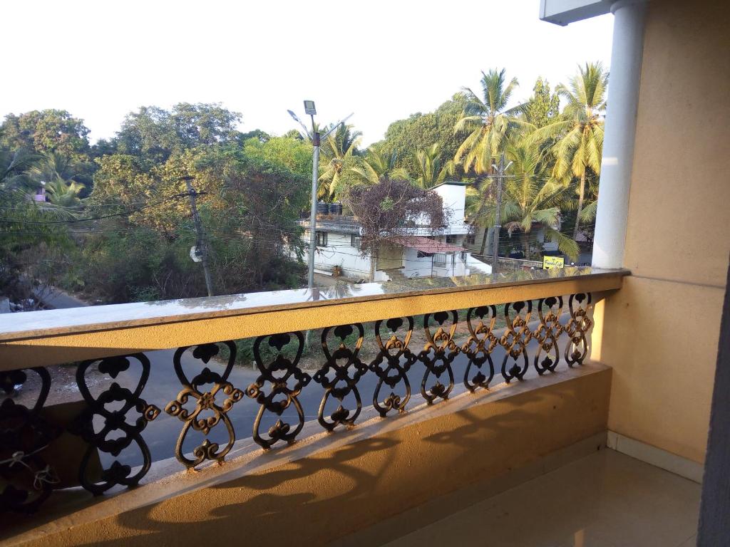 a balcony with a view of palm trees at Cassi Studio with a view in Varca