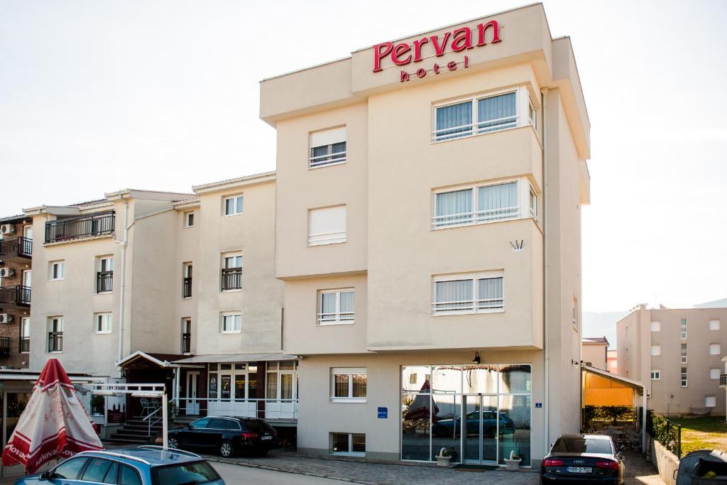 a building with a pentán hotel sign on it at Hotel Pervan in Međugorje