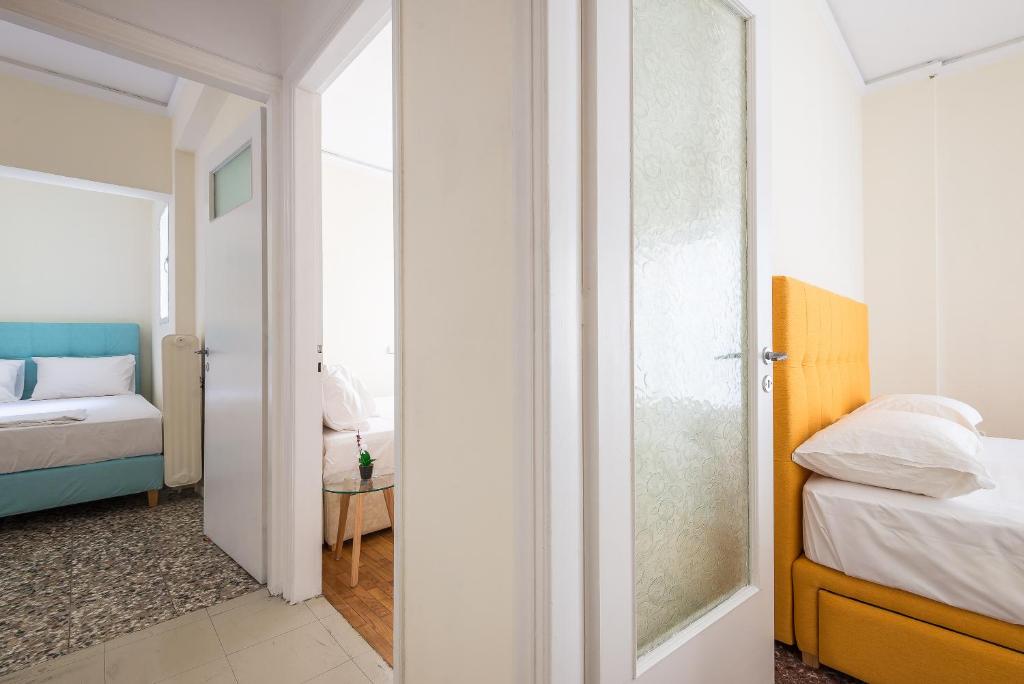 Posteľ alebo postele v izbe v ubytovaní Acropolis View Paradise Apartments