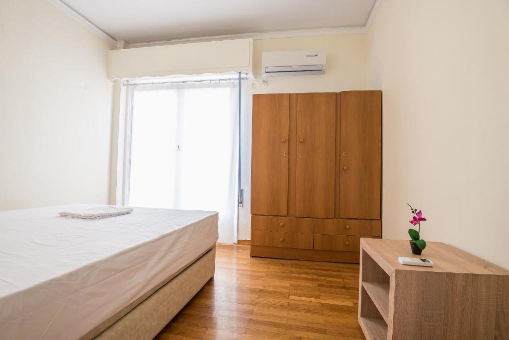Posteľ alebo postele v izbe v ubytovaní Acropolis View Paradise Apartments