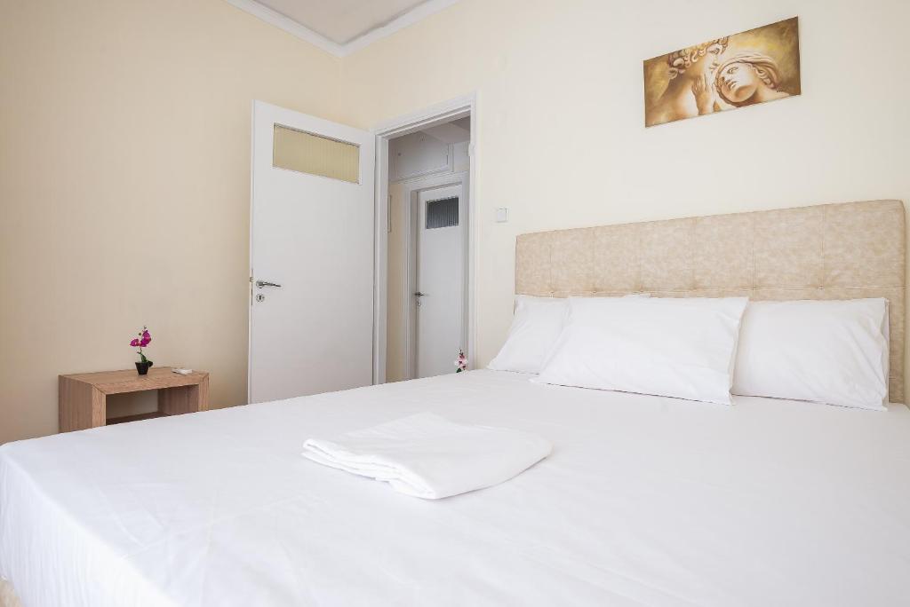 Posteľ alebo postele v izbe v ubytovaní Acropolis View Paradise Apartments
