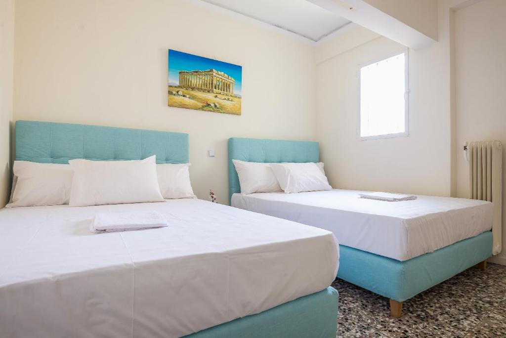 Posteľ alebo postele v izbe v ubytovaní Acropolis View Paradise Apartments