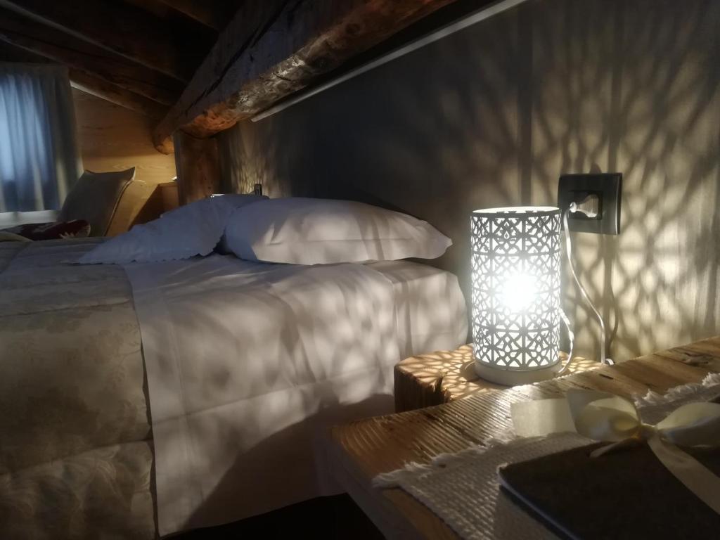 Postel nebo postele na pokoji v ubytování Albergo Pa' Krhaizar
