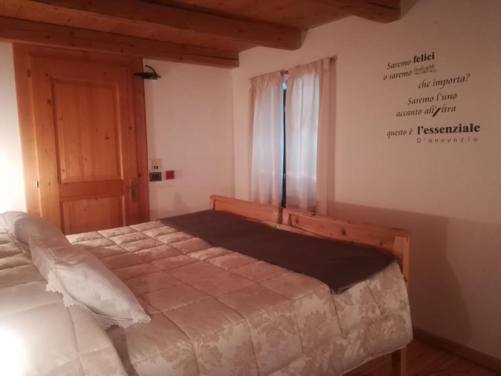 Postel nebo postele na pokoji v ubytování Albergo Pa' Krhaizar