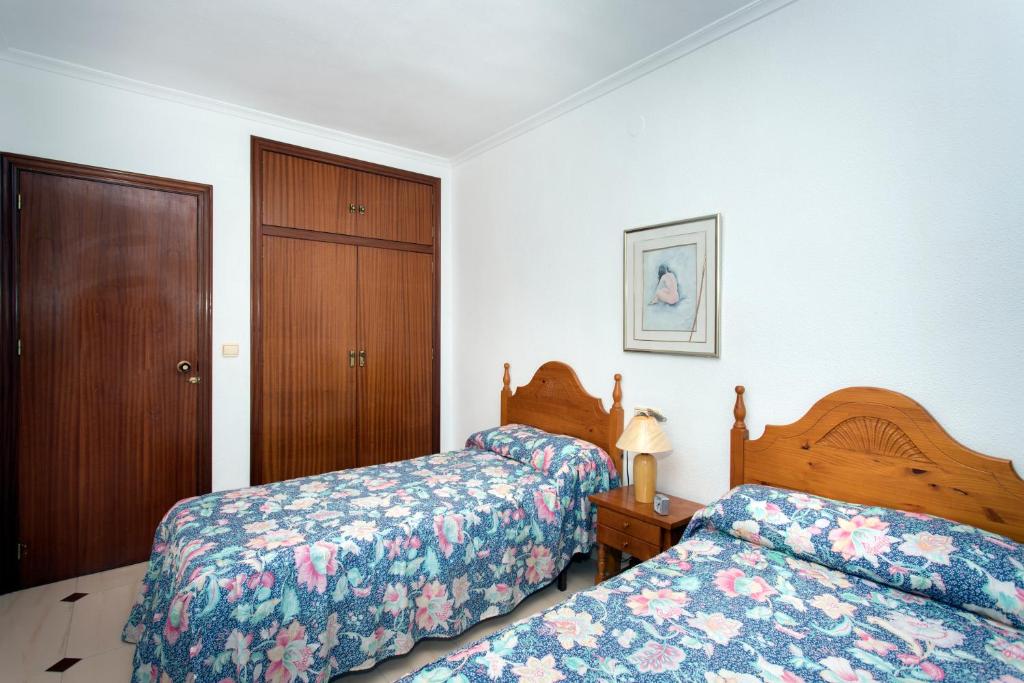 Postel nebo postele na pokoji v ubytování HE Cabo Cervera