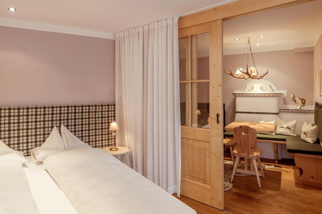 Postel nebo postele na pokoji v ubytování Hotel Bergwelt