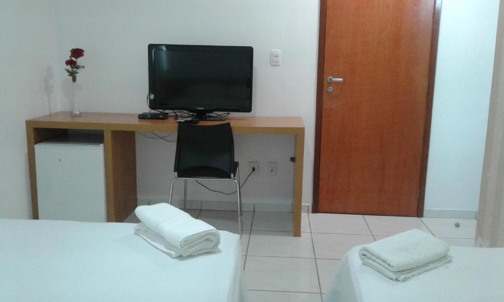 TV a/nebo společenská místnost v ubytování Hotel Talissa 2