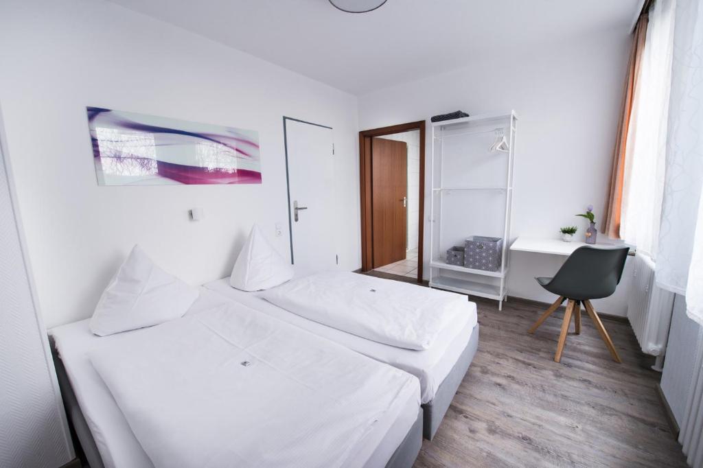 Postel nebo postele na pokoji v ubytování SOVA Hotel