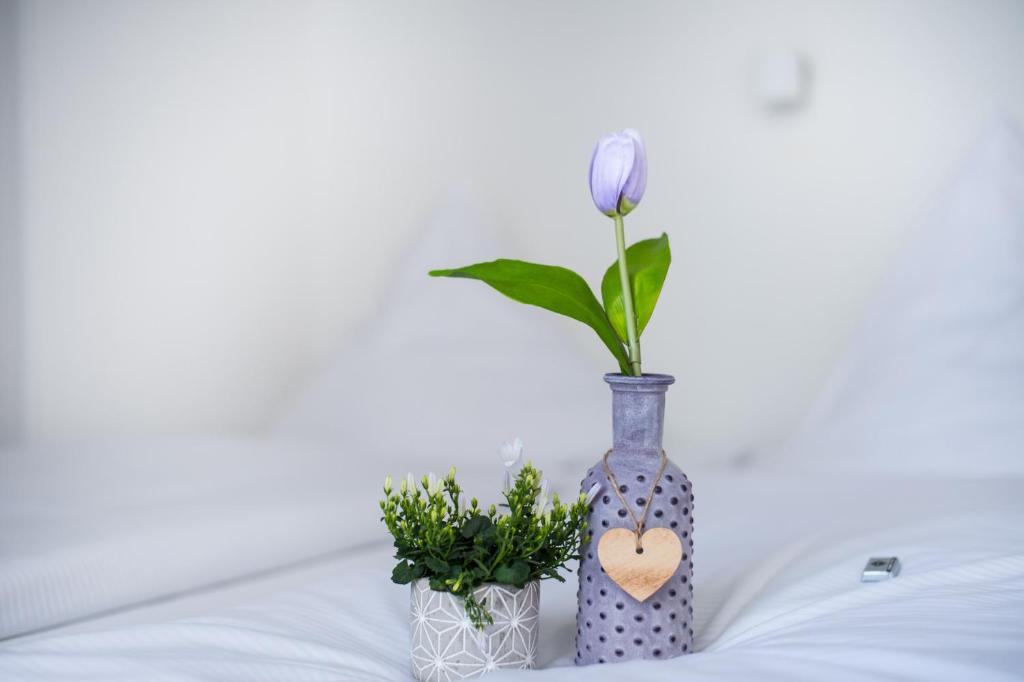 Postel nebo postele na pokoji v ubytování SOVA Hotel