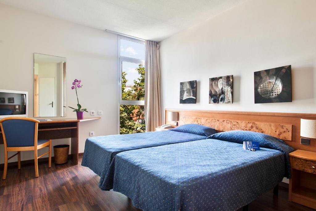 Postel nebo postele na pokoji v ubytování Crisol Quality Reus