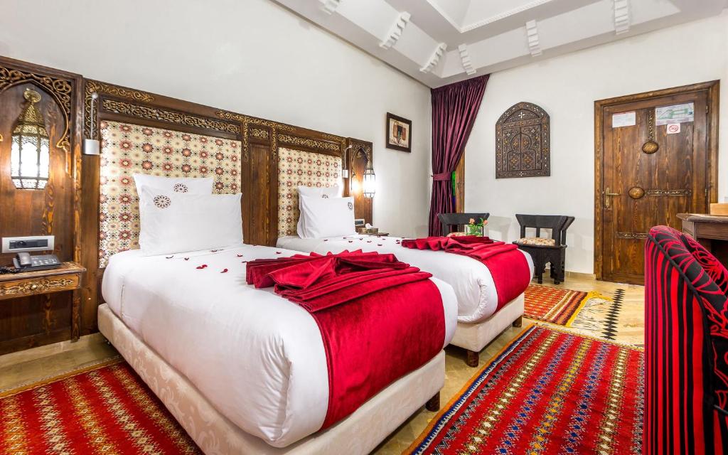 Postel nebo postele na pokoji v ubytování Hotel & Ryad Art Place Marrakech