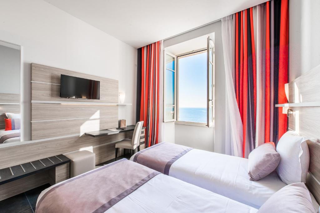Postel nebo postele na pokoji v ubytování Hotel Le Saint Paul