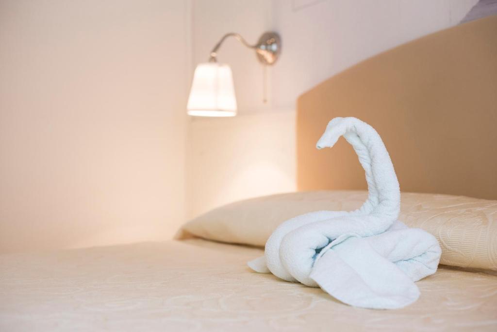 Postel nebo postele na pokoji v ubytování Sirena Boutique Hotel