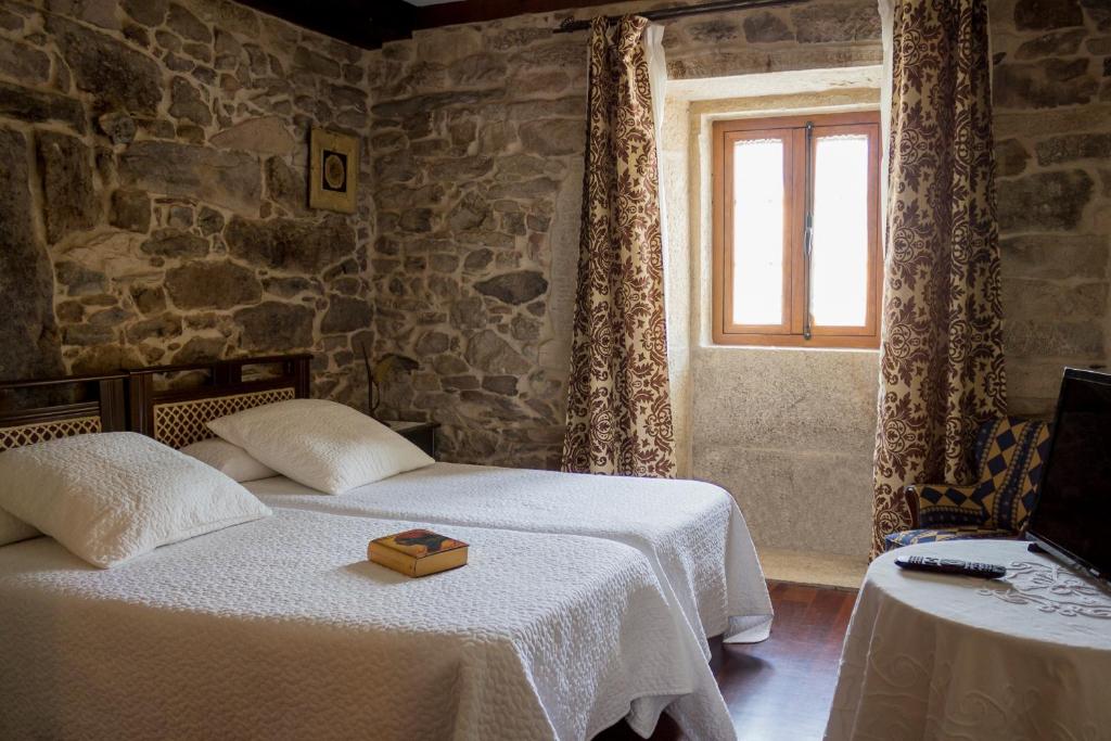 A bed or beds in a room at Casa Roan y Casa Grande
