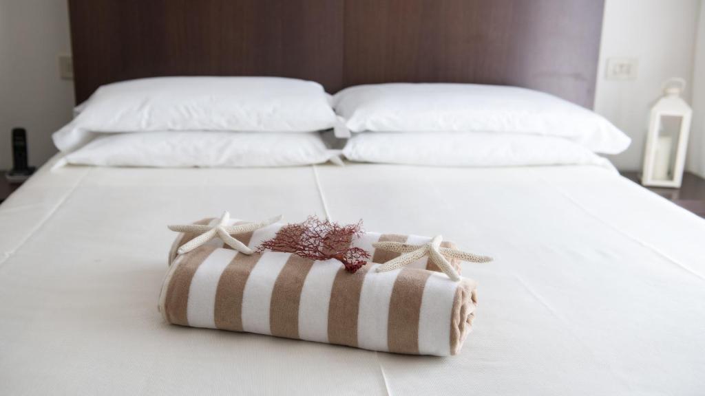 Postel nebo postele na pokoji v ubytování Hotel Cristina Corona