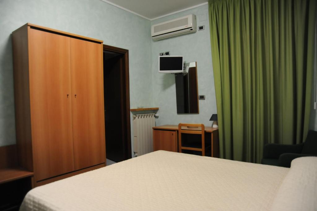 Postel nebo postele na pokoji v ubytování Hotel Valentini Inn
