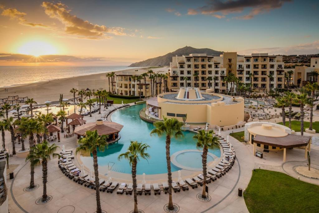 an aerial view of a resort with a pool and a beach at Pueblo Bonito Pacifica Golf & Spa Resort - All Inclusive - Adults Only in Cabo San Lucas