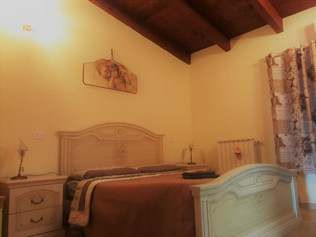 Postel nebo postele na pokoji v ubytování B&B Borgo la Marina