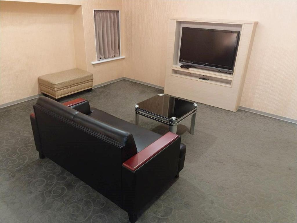 TV a/nebo společenská místnost v ubytování Beidoo Hotel