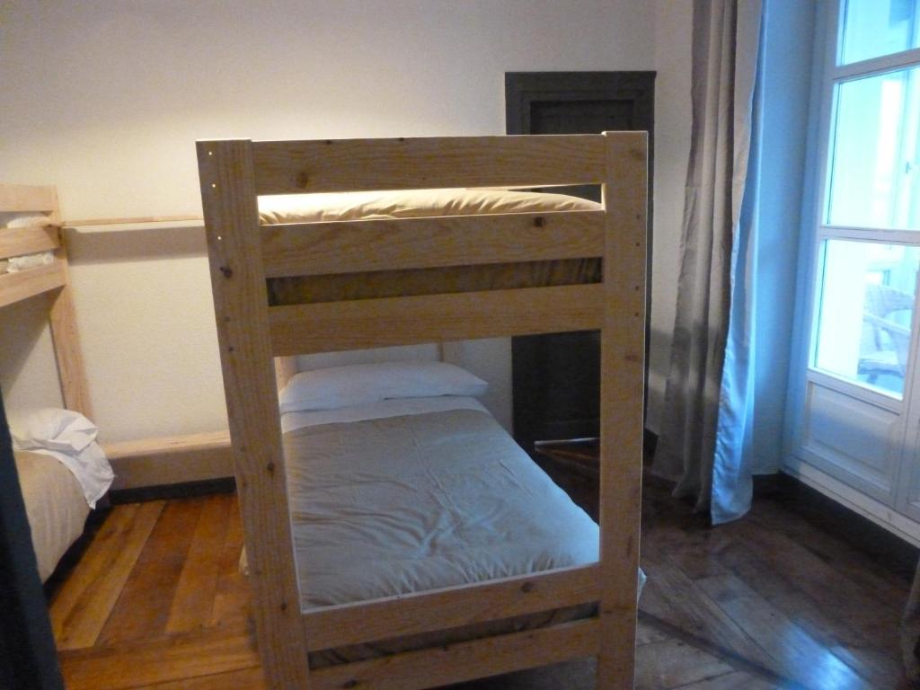 Postel nebo postele na pokoji v ubytování Hostal del Arquitecto