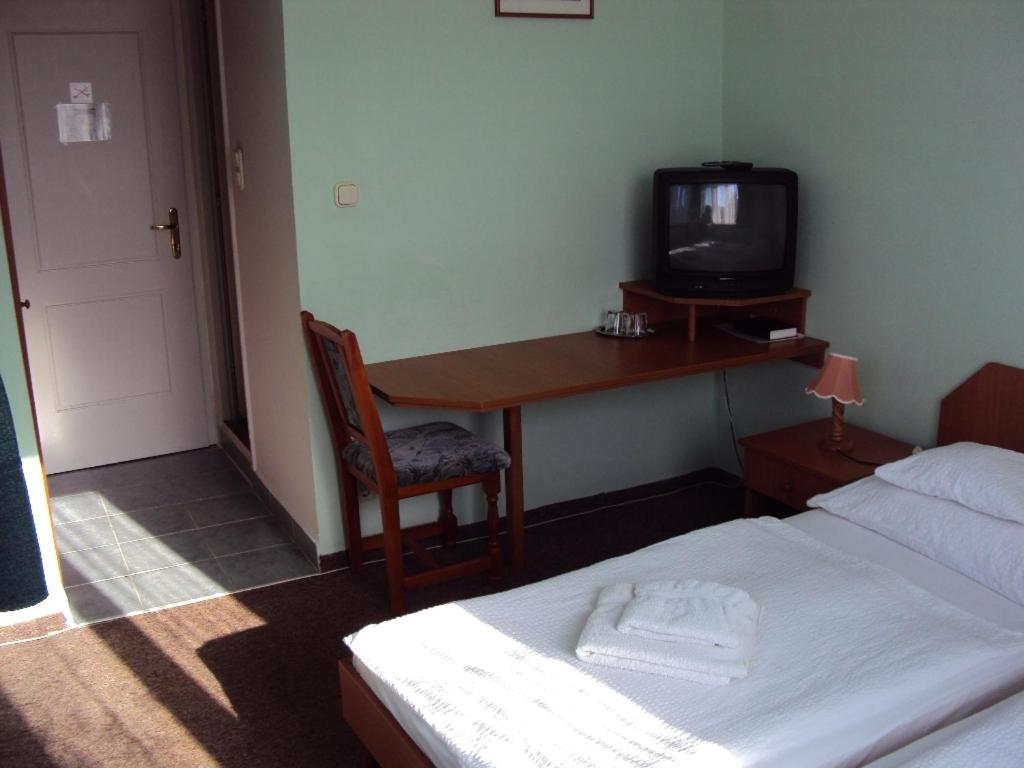 Postel nebo postele na pokoji v ubytování Füzi Panzió