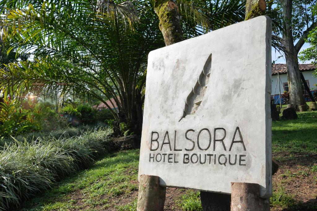 a sign for a hotel room at Balsora Hotel Boutique in La Tebaida