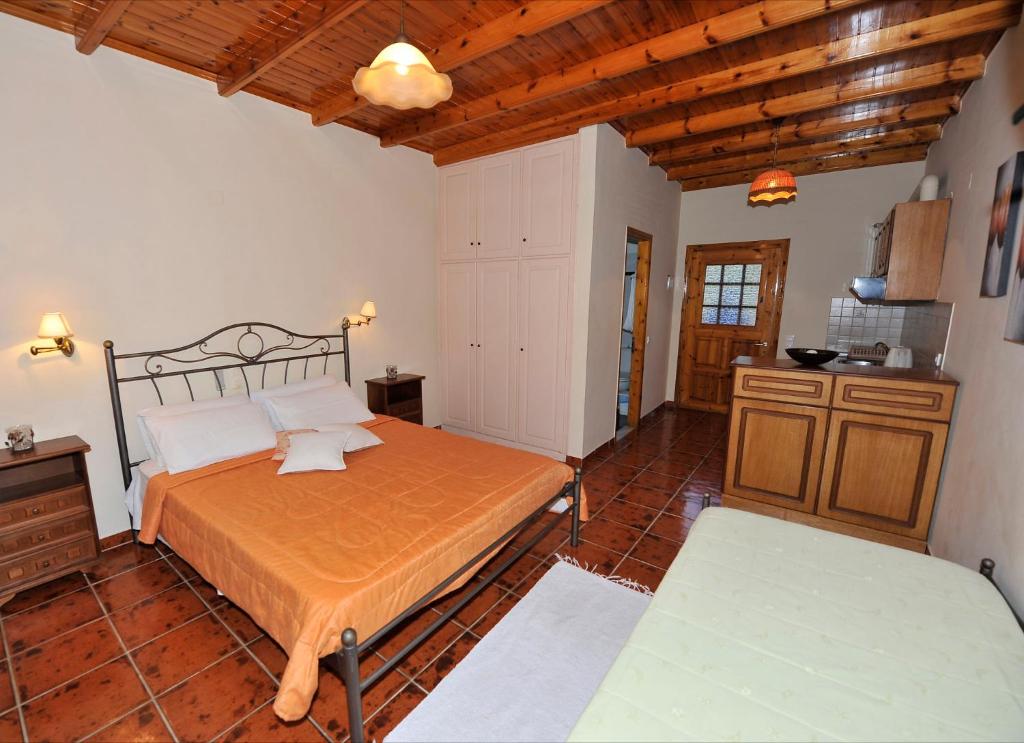 A bed or beds in a room at Pieros Studios Lisipios