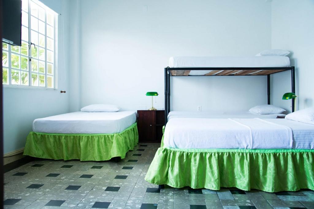 Cama o camas de una habitación en Hotel Savoy