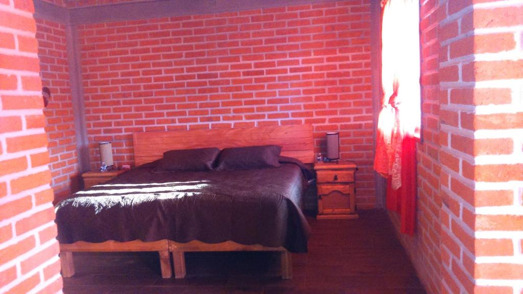 Postel nebo postele na pokoji v ubytování Cabañas villa de San Miguel