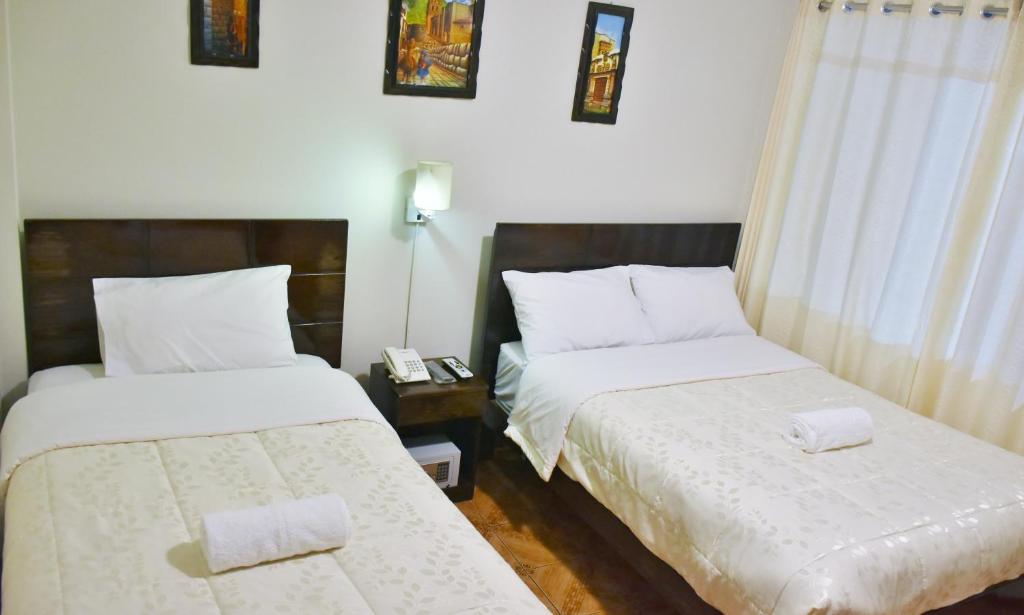 Postel nebo postele na pokoji v ubytování Machupicchu Guest House