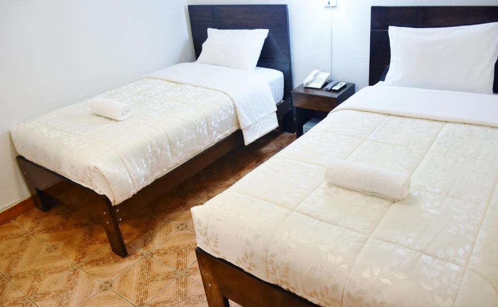 Postel nebo postele na pokoji v ubytování Machupicchu Guest House