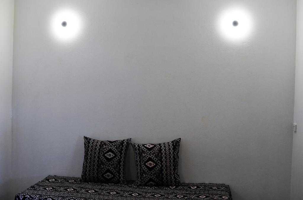 Postel nebo postele na pokoji v ubytování Grand West Villas