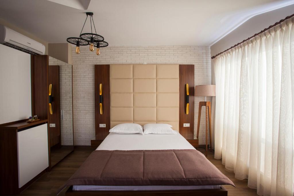 Postel nebo postele na pokoji v ubytování Maxuite Hotel in Home
