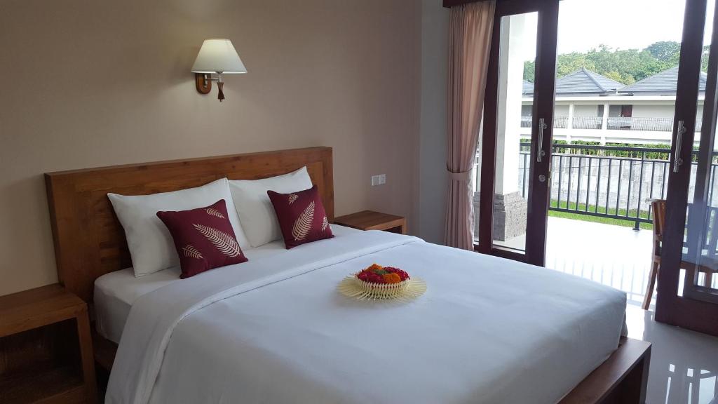 Postel nebo postele na pokoji v ubytování Umayuri Inn