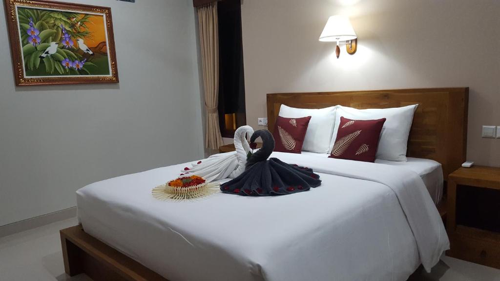 Postel nebo postele na pokoji v ubytování Umayuri Inn