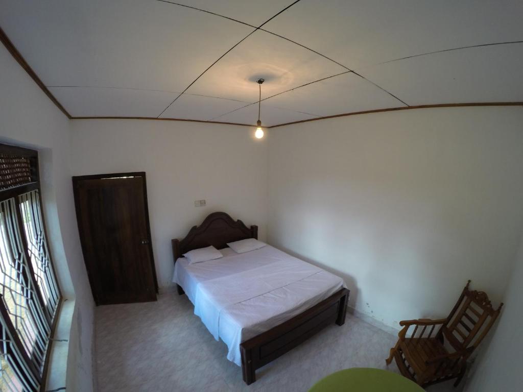 Postel nebo postele na pokoji v ubytování Bimanjee Mango Resort