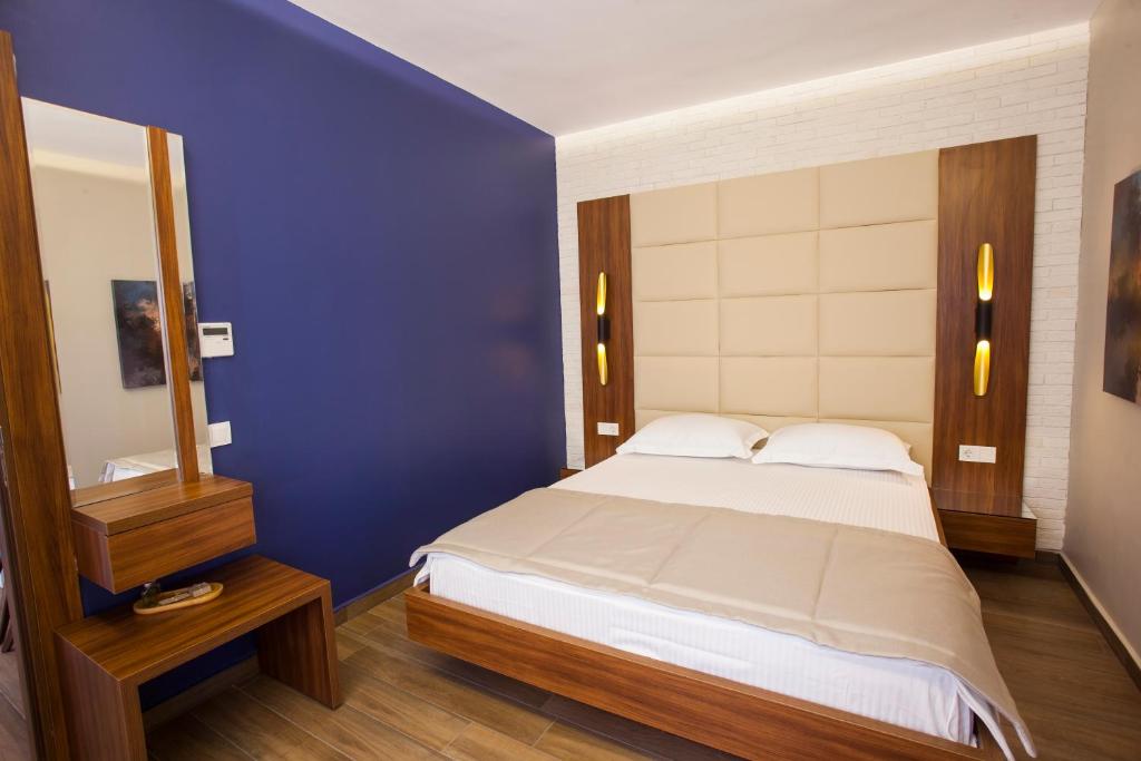 Postel nebo postele na pokoji v ubytování Maxuite Hotel in Home