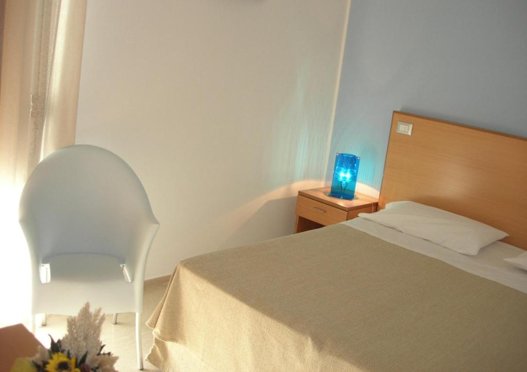 Postel nebo postele na pokoji v ubytování Le Saline Hotel